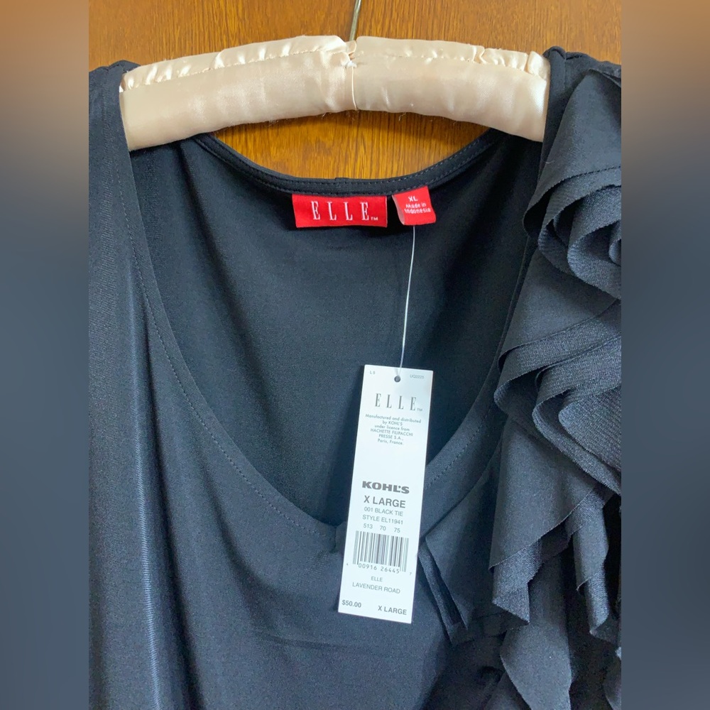 Little black dress .  Brand new with tags smoke free home .  Cedar lined closet